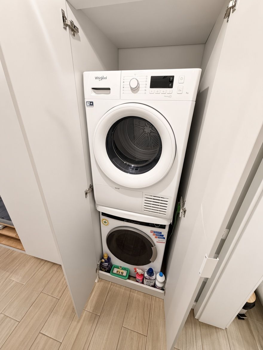 Washing machine and dryer, in a cabinet